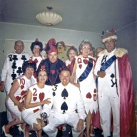 05/64 - District 4C-4 Convention, Hoberg’s Resort, Lake County - L to R, back row: member, Estelle Bottarini, Pete Bello, wife, Emma & Joe Giuffre, outgoing District Governor; behind them peeking in is Irene Tonelli and Al Kleinbach; front row kneeling: Pat Ferrera, Eva Bello, and Frank Ferrera.
