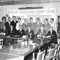 1964-65 Governor's Official Visition: L to R, standing: Bob Dobbins, Ron Faina, Joe Giuffre, Art Blum, Frank Bulleri, cabinet member, cabinet member, cabinet member, Pete Bello, and guest; sitting: guest, guest, Charlie Bottarini, Gilbert Larish, DG; Bill Tonelli, guest, and guest.