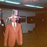 May 1971 Convention - Lions on parade wearing hat depicting various Lions services and events - Charlie Bottarini in foreground.