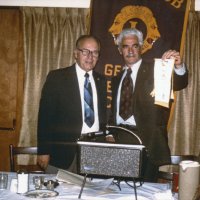 11/5/75 - District Governor Lee Shore’s Official Visitation, Granada Cafe, San Francisco - L to R: Lee Shore, DG, and Al Gentile. President Al Gentile presenting our Club banner to the District Governor.