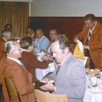 11/5/75 - District Governor Lee Shore’s Official Visitation, Granada Cafe, San Francisco - Right side, back to front: Carl Muelendorf, Joe Giuffre, Ervin Smith, Bob Woodall, and Charles Stuhr. Left side, back to front: member, Frank Bulleri, Pete Bello, Frank Ferrera (standing), and Charles Bottarini.