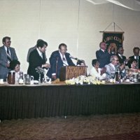 6/17/78 - Installation of Officers, Ramada Inn, S.F. Airport, Millbrae - L to R: standinig: Bob Pacheco, Dick Harrison, Joe Farrah, Leonardo Bacci, Fred Melchiori, Ozzie Buoncristiani, and Bill Tonelli; seated: Trudy Bacci, Emily Farrah, Elena, and Pat & Marjorie Martin. Leonardo Bacci as he completes installing Joe Farrah as president.