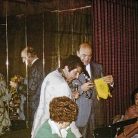 9/15/78 - Regular Meeting, L & L Castle Lanes, San Francisco - Sandy Masonek  of Wholesale Furs, Joe Farrah, John Dossetti, and Emily Farrah. Joe Farrah presenting PP John Dossetti of the Morgan Hill Lions with our Club banner.