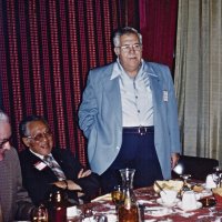 2/14/79 - Past District Governors Night & New Member Induction, L & L Castle Lanes, San Francisco - L to R, seated and standing: PDF Maurice Perstein (partial), PDG Chan Wah Lee, and PDG Joe Giuffre. PDG Joe Giuffre, from the Geneva-Excelsior Lions, telling tales about his year as District Governor in 1963-64; he was an excellent story teller.