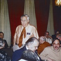 2/7/79 - Past Presidents’ Night, L & L Castle Lanes, San Francisco - Each past president, oldest to newest, gave remarks about his year as president. Joe Giuffre, 1958-59. L to R (some with back to camera): far side: Frank Ferrera (partial), Charlie Bottarini, Pete Bello, and obscured; next row: Bob Woodall, Joe Giuffre (standing), Al Kleinbach, Fred Melchiori, Fred Krahl; closest table: Don Bacioco, guest, and guest.