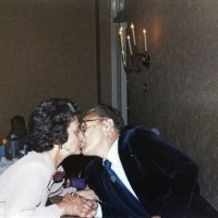 7/25/82 - 32nd Installation of Officers, Olympic Golf & Country Club, San Francisco - Foreground: Eva Bello kissing PDG Bill Tonelli. Background left: Linda & John Madden.