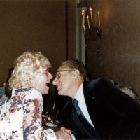 7/25/82 - 32nd Installation of Officers, Olympic Golf & Country Club, San Francisco - L to R: Ron Faina looks on as Linnie Faina kisses PDG Bill Tonelli.