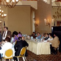 7/25/82 - 32nd Installation of Officers, Olympic Golf & Country Club, San Francisco - Most of audience obscured; on left, blue suit back to camera, is Walt Jebe, standing in lavender dress is Margot Clews. Head table, L to R: Incoming President Handford, Emma Giuffre, PDG Les & Mary Davis, Irene & PDG Bill Tonelli, and Frances & Outgoing President Mike Spediacci.