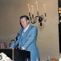 7/25/82 - 32nd Installation of Officers, Olympic Golf & Country Club, San Francisco - L to R: seated: Incoming President Handford Clews, Emma & PDG Joe Giuffre; at podium is PDG Les Davis, installing officer, and Mary Davis.