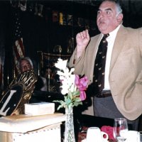 4/13/83 - Guest Speaker Program, L & L Castle Lanes, San Francisco - Frank Zumwalt, seated on left, and our guest speaker at podium.