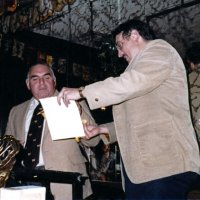 4/13/83 - Guest Speaker Program, L & L Castle Lanes, San Francisco - Handford Clews, right, presenting our guest speaker with a cerrificate of appreciation and club banner for his efforts. Frank Zumwalt in left corner.