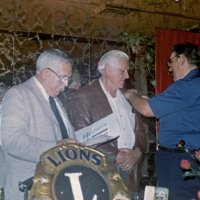 7/14/82 - New Member Induction, L & L Castle Lanes, San Francisco - Howard Pearson - L to R: PDG Joe Giuffre, Howard Pearson, and Handford Clews who is pinning new inducted Lion Howard with his Lions pin.