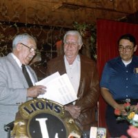 7/14/82 - New Member Induction, L & L Castle Lanes, San Francisco - Howard Pearson - L to R: PDG Joe Giuffre, inducting new Lion Howard Pearson, with his sponsor Handford Clews looking on.