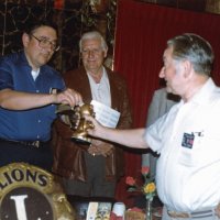 7/14/82 - New Member Induction, L & L Castle Lanes, San Francisco - Howard Pearson - Tail Twister Frank Ferrera, right, collects a fine from sponsor Handford Clews while newly inducted Lion Howard Pearson looks on.