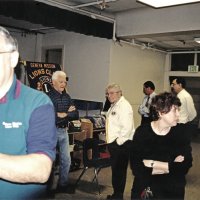 12-20-02 - Mission Education Center Christmas with Santa, Mission Education Center, San Francisco - L to R: Aaron Straus, Al Gentile, Joe Farrah, Steve Currier, Deborah Molof, Principal, Sheriar Irani, and Dick Johnson standing around waiting for the event to start.