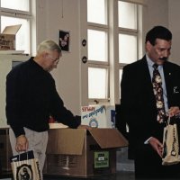 12-20-02 - Mission Education Center Christmas with Santa, Mission Education Center, San Francisco - Dick Johnson, left, and Steve Currier get gift bags ready for the next students.