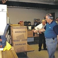 12-20-02 - Mission Education Center Christmas with Santa, Mission Education Center, San Francisco - L to R: Joe Farrah, Aaron Straus (telling the others about the boxes of presents), Sheriar Irani, and Dick Johnson before the start of the event.