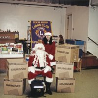 12-20-02 - Mission Education Center Christmas with Santa, Mission Education Center, San Francisco - Santa and his assistant pose with all the empty boxes that once contained the gifts they have given out during their visit.