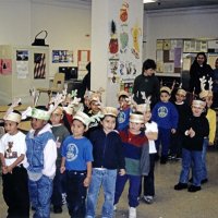 12-20-02 - Mission Education Center Christmas with Santa, Mission Education Center, San Francisco - The first class of students coming in herded by their teacher. Support staff are in the background.