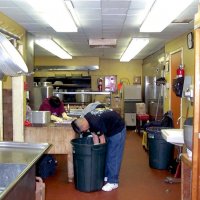 2/23/2002 - Recreation Center for the Handicapped, San Francisco - 20th Annual Crab Feed - Kitchen helpers placing crab in serving trays before dinner.