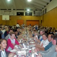 2/23/2002 - Recreation Center for the Handicapped, San Francisco - 20th Annual Crab Feed - Michele Salet, lower left, with Kathy Salet (pink sweater), enjoying dinner with other guests.