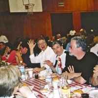 2/26/05 - Recreation Center For the Handicapped, San Francisco - 23rd Annual Crab Feed - 429 attending - guests having dinner. Lyle Workman, waving, and Bob Fenech to his left.