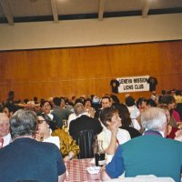 2/26/05 - Recreation Center For the Handicapped, San Francisco - 23rd Annual Crab Feed - 429 attending - members and guests enjoying dinner. Sheriar Irani (center row with glasses and bib on), with Diane Donnelly at foreground table in white blouse.