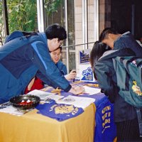 3/4/05 - Lowell Leo Club - Members of the Leos display Leo and Lions information at a fair at their school while discussing membership with other students.