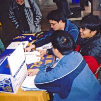 3/4/05 - Lowell Leo Club - Members of the Leos display Leo and Lions information at a fair at their school while discussing membership with other students.