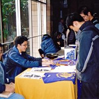3/4/05 - Lowell Leo Club - Members of the Leos display Leo and Lions information at a fair at their school while discussing membership with other students.