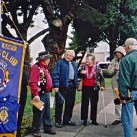 6/8/05 - L to R: Bob Lawhon, Joe Farrah, with Donna Francesconi, and Bill Graziano, Gerald Lowe (pulling up hood), and Al Gentile gathered at the recently installed Giulio Francesconi “Barbary Coast Trail” memorial plaque on Washington Square’s sidewalk opposite Moose's Restaurant.