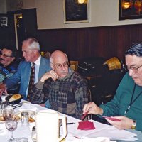 1/19/05 - Granada Cafe -  L to R: guest Ernie Braun, with Ward Donnelly, Bill Graziano, and Handford Clews following our guest speaker's presentation. Handford is counting out Crab Feed tickets for members.