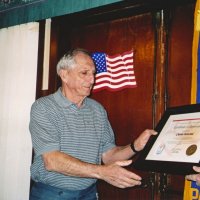 1/5/05 - Granada Cafe - Charlie Bottarini receiving a certificate from Lions International celebrating his 50 years of service as a Lions member.