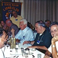 9/1/04 - Granada Cafe - A busy Business & Board Meeting. On the left are George Salet, and Dick Johnson. Center, starting at the head table is Bre Martinez, Bill Graziano, Al Gentile, Aaron Straus, and Lyle Workman. Standing is President Bob Lawhon. Other Lions and guest are in the background.