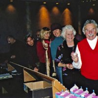 11/27/05 - 27th Annual Giulio Francesconi Charity Raffle Drawing at the Italian American Social Club - As is the custom, ticket holders are invited to choose their numbered ping pong ball and toss it in the drawing drum. Shown are two guests at the far end, and going up the line are two guests, Roxanne Gentile, guest, and John Fiore, proudly displaying his numbered ball.