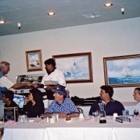8/17/05 - Sharp Park Golf Course, Pacifica - Lion Chairman Bob Fenech (out of picture) commenting about the tournament. Standing: Lion Dick Johnson. Seated: Lion Ernie Braun, guest, Leona Wong, guest, John Jones, and Lion Bre Martinez.