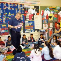 2/17/06 - Flag Day Program at Mission Educational Center for 211 students - Lion Aaron Straus gets close and personal with students while talking about the meaning of the flag and its history.