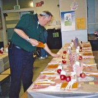 11/22/05 - Mission Educational Center, San Francisco - Lions Aaron Straus and Bre Martinez working on table settings.