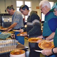 11/22/05 - Mission Educational Center, San Francisco - L to R: Lions Lyle Workman, Sheriar Irani, Al Gentile, and Joe Farrah waiting for the plates to be dished before serving the students.