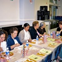 11/22/05 - Mission Educational Center, San Francisco - Visitors and principal Deborah Molof (at head of table) enjoying lunch and discussing the event.