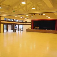 2/23/08 - 26th Annual Crab Feed - Janet Pomeroy Recreation & Rehabilitation Center, San Francisco - Arriving early to help setup are, on left, are Bill Graziano, next to pole, and Bob Fenech, walking in to the gym where the dining took place. On the right is George Salet, chairman, facing away from camera, with the custodian.