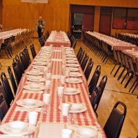 2/23/08 - 26th Annual Crab Feed - Janet Pomeroy Recreation & Rehabilitation Center, San Francisco - With much of the table settings done, Bill Graziano is placing more cups.