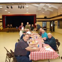 2/23/08 - 26th Annual Crab Feed - Janet Pomeroy Recreation & Rehabilitation Center, San Francisco - After the tables are all set and it’s time for lunch. Seated, front to back, left side: George Salet, Bob Fenech, Bob Lawhon, Charlie Bottarini, and Bill Graziano; right side: Joe Farrah, Aaron Straus, and Ward Donnelly; standing, L to R: Mike Castagnetto, Jr., Al Gentile, helper (green plaid shirt), Mike Castagnetto, and Dick Johnson. Handford Clews in right background.