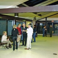 2/23/08 - 26th Annual Crab Feed - Janet Pomeroy Recreation & Rehabilitation Center, San Francisco - Guests talking while waiting for dinner; Pat Bell, long time supporter, stands to the right of guest in red sweater.