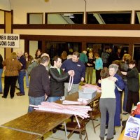 2/23/08 - 26th Annual Crab Feed - Janet Pomeroy Recreation & Rehabilitation Center, San Francisco - Guests purchasing raffle tickets before dinner; Estelle Bottarini, in long blue coat, with Margot Clews behind her.