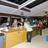 2/23/08 - 26th Annual Crab Feed - Janet Pomeroy Recreation & Rehabilitation Center, San Francisco - Guests getting drinks before dinner; behind the bar are, L to R: helper, Mick Dimas, Bob Lawhon, and Al Gentile.