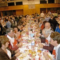 2/23/08 - 26th Annual Crab Feed - Janet Pomeroy Recreation & Rehabilitation Center, San Francisco - Guests beginning to enjoy dinner with salad. Charlie Bottarini, standing with white shirt, checking on guests.