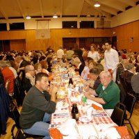 2/23/08 - 26th Annual Crab Feed - Janet Pomeroy Recreation & Rehabilitation Center, San Francisco - Guests beginning to enjoy dinner with salad. First on left is Bob Lawhon; Charlie Bottarini, stand at end of table, checking on guests.