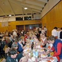 2/23/08 - 26th Annual Crab Feed - Janet Pomeroy Recreation & Rehabilitation Center, San Francisco - Guests beginning to enjoy dinner with salad. Left side: Margot Clews; right side: LaVerne Cheso. Charlie Bottarini, standing center left, checking on guests.