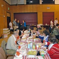 2/23/08 - 26th Annual Crab Feed - Janet Pomeroy Recreation & Rehabilitation Center, San Francisco - Guests beginning to enjoy dinner with salad. Aaron Straus, in blue shirt, stands near doorway in the background.